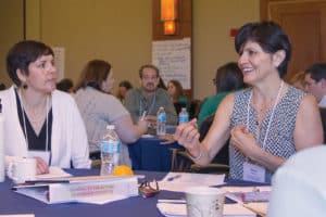 Annie Lewis (left), librarian at Multnomah County (Oreg.) Library, listens as Nancy Herrera, librarian at Contra Costa County (Calif.) Library, makes her presentation at the 2016 ALA Leadership Institute in Itasca, Illinois. The institute—developed and led by former ALA President Maureen Sullivan (2012–2013)—offers midcareer librarians the opportunity to take part in a four-day immersive leadership development program.